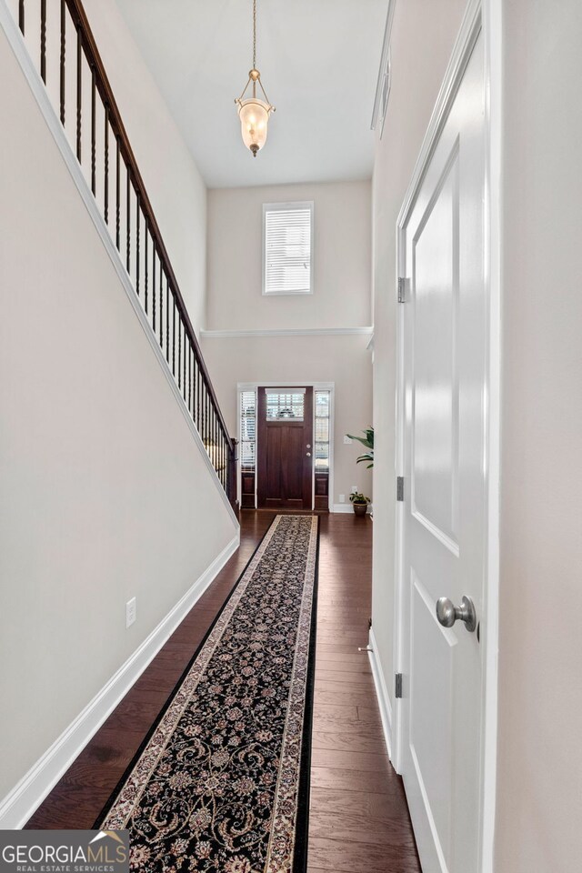 carpeted bedroom featuring ceiling fan, crown molding, and beam ceiling