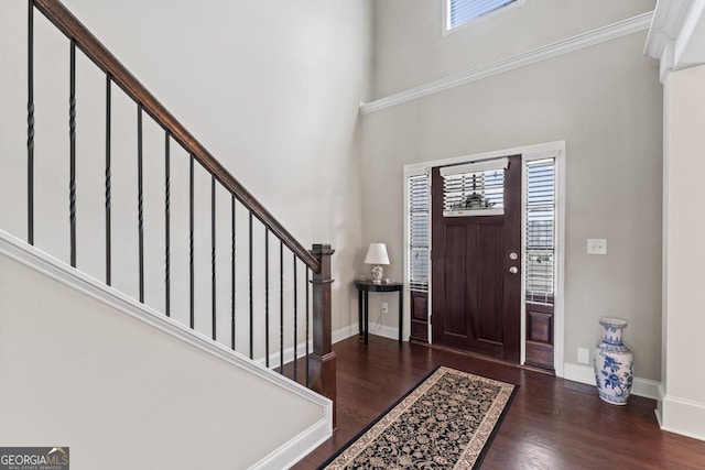 foyer with dark hardwood / wood-style floors