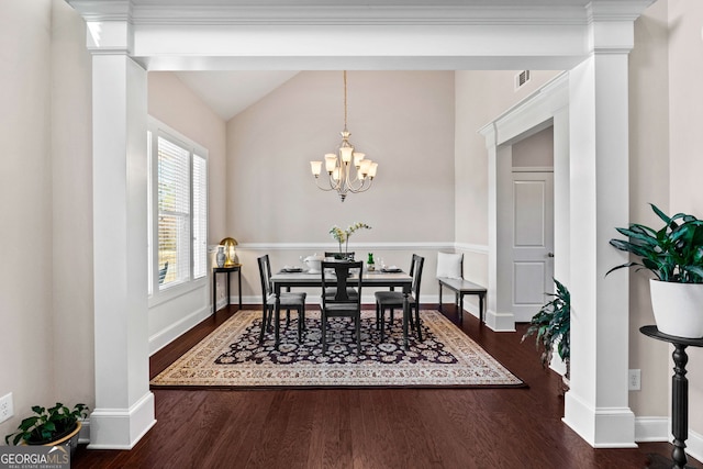 dining space with a chandelier, lofted ceiling, visible vents, baseboards, and dark wood finished floors