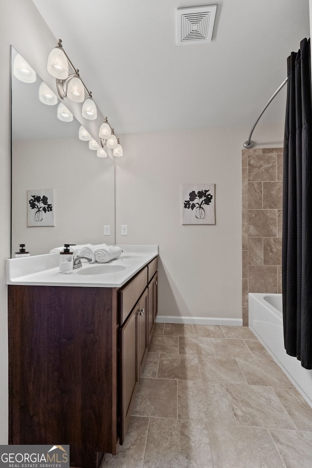 full bathroom featuring visible vents, baseboards, vanity, and shower / bathtub combination with curtain