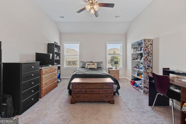 bedroom featuring lofted ceiling, baseboards, light carpet, and visible vents