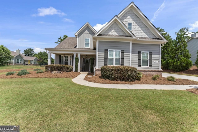 craftsman-style home featuring a front yard