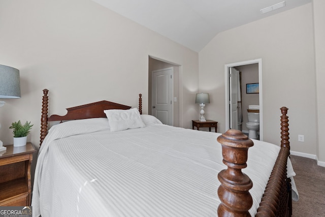 carpeted bedroom with vaulted ceiling, ensuite bath, visible vents, and baseboards