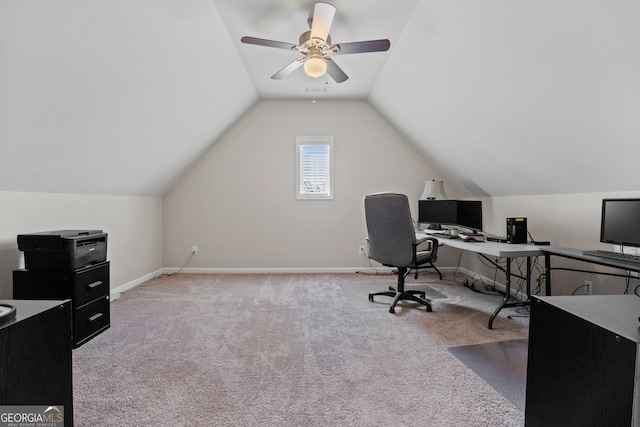 office featuring light carpet, ceiling fan, baseboards, and vaulted ceiling