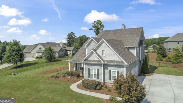 view of front of home featuring a front yard and a garage