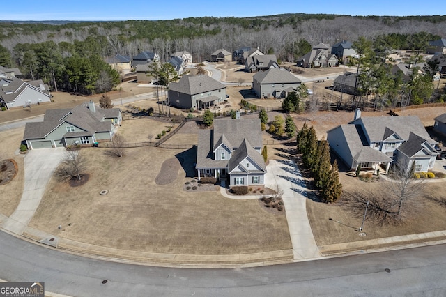 birds eye view of property with a residential view