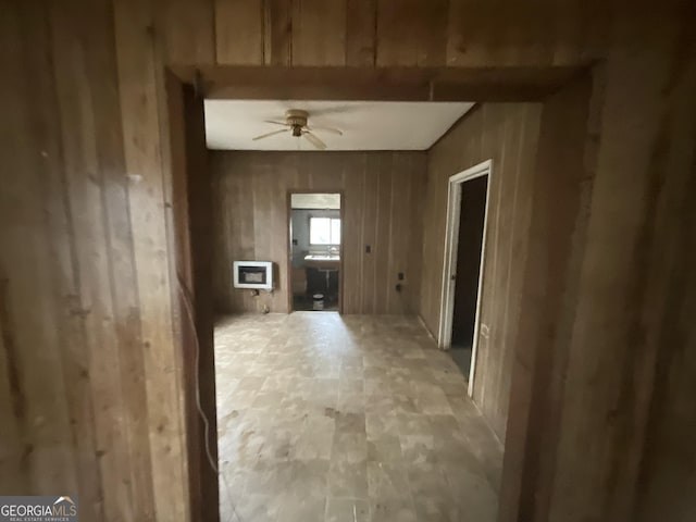 interior space featuring wooden walls