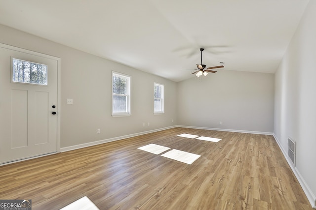 interior space featuring vaulted ceiling, ceiling fan, and light hardwood / wood-style flooring