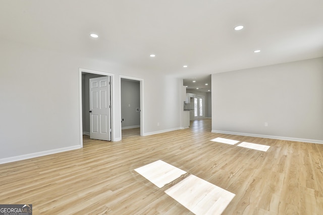 spare room featuring light wood-type flooring