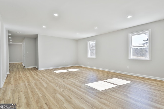 spare room with light hardwood / wood-style flooring