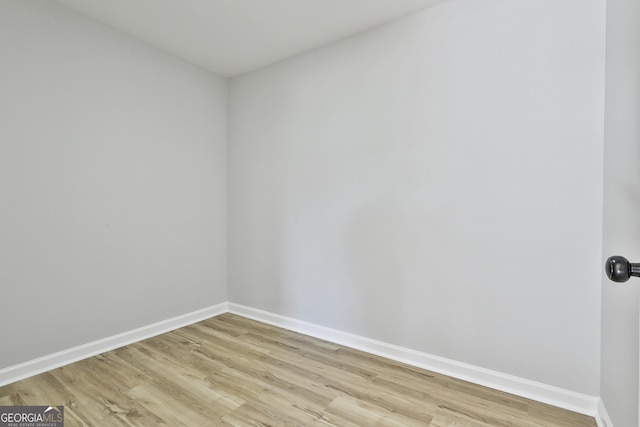 spare room with light hardwood / wood-style flooring