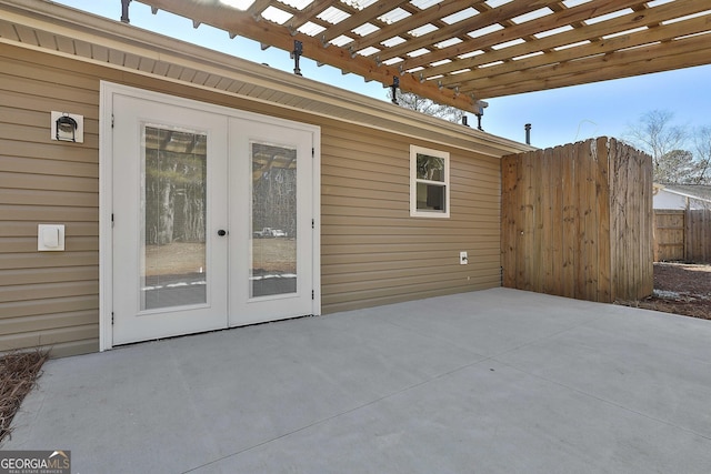 view of patio with french doors and a pergola