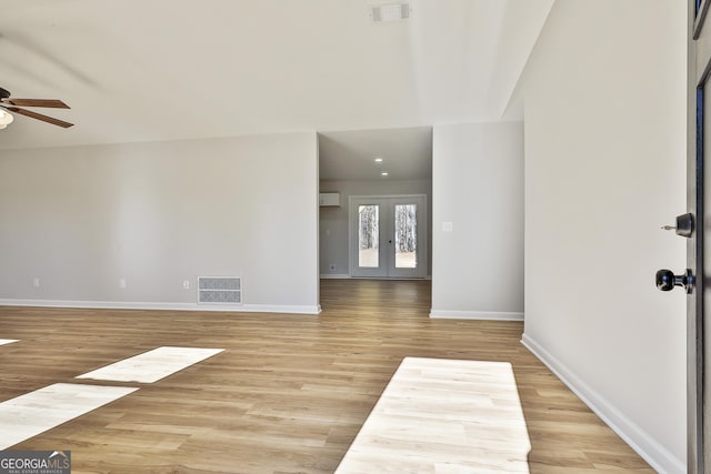 interior space featuring ceiling fan, light hardwood / wood-style flooring, and french doors