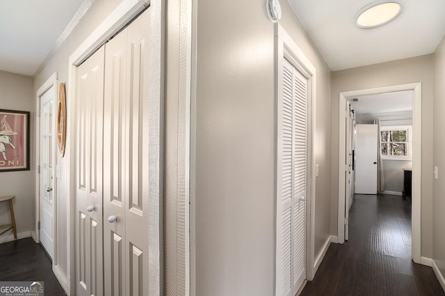 hallway featuring dark hardwood / wood-style flooring