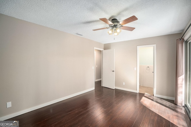 unfurnished bedroom with a textured ceiling, ceiling fan, and dark hardwood / wood-style floors