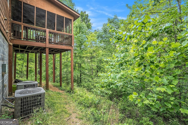 905 Hancock Mountain Trl, Waleska, GA 30183 - view of yard featuring central air condition unit and a sunroom