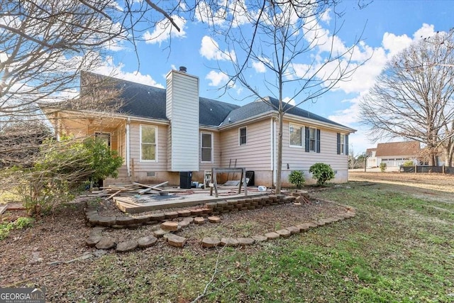 back of property featuring a yard and a patio