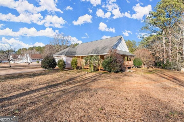 view of property exterior featuring a lawn