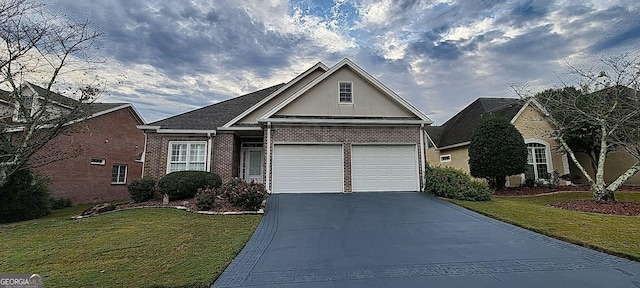 view of front of house featuring a front lawn and a garage