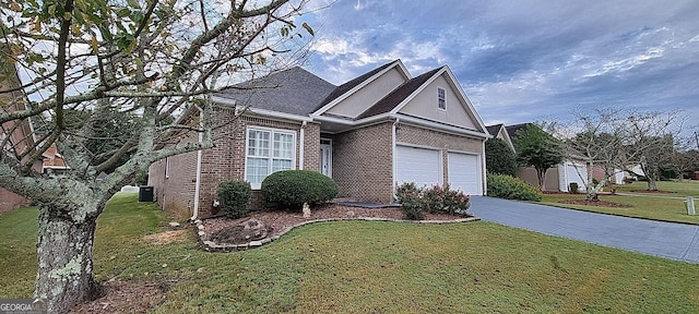 view of front facade with a front yard and a garage