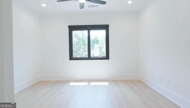 unfurnished room featuring ceiling fan and light hardwood / wood-style floors