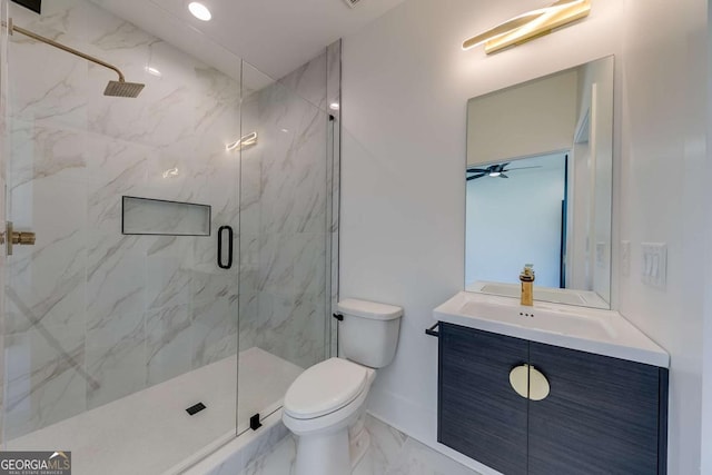 bathroom featuring toilet, vanity, ceiling fan, and an enclosed shower