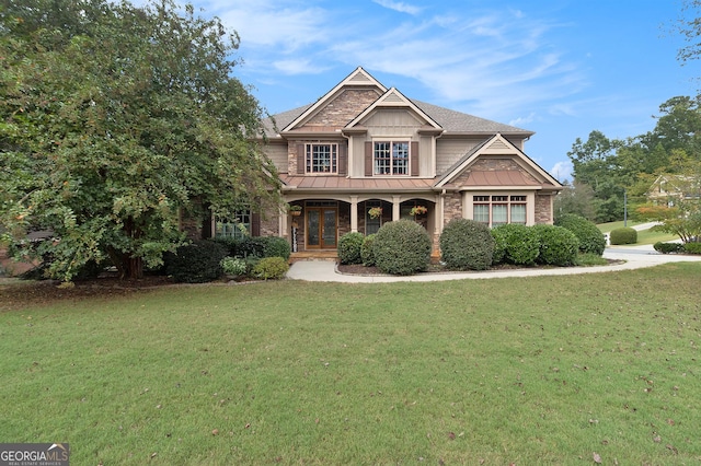 view of front of home with a porch and a front lawn