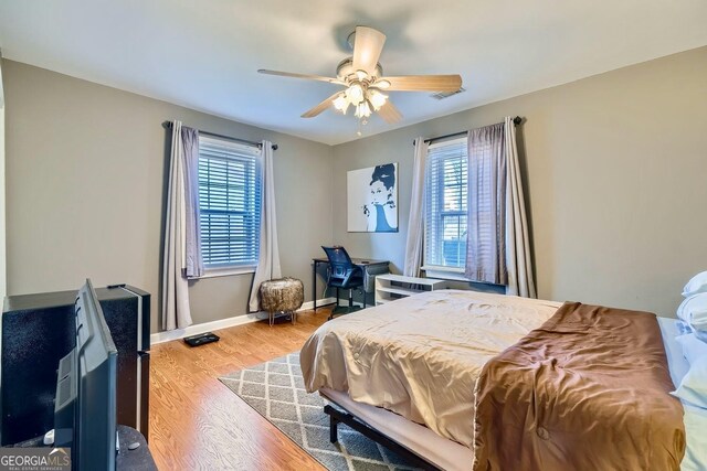 bedroom featuring ceiling fan and hardwood / wood-style floors