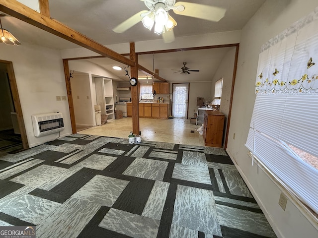 living room featuring baseboards, vaulted ceiling with beams, heating unit, and ceiling fan