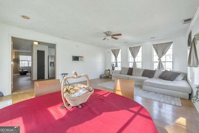 dining area featuring ceiling fan and hardwood / wood-style floors