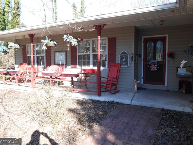 view of patio featuring a porch