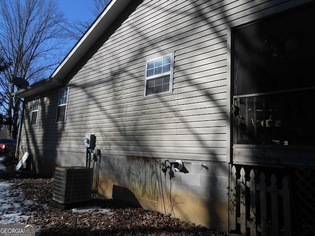 view of home's exterior with central AC unit