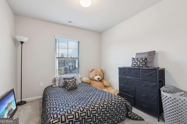 bedroom with light carpet