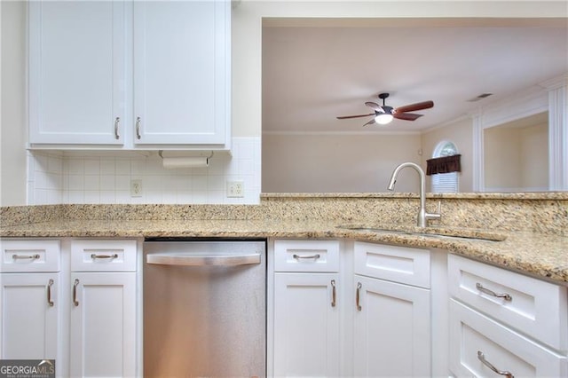 kitchen featuring dishwasher, sink, light stone countertops, and white cabinets