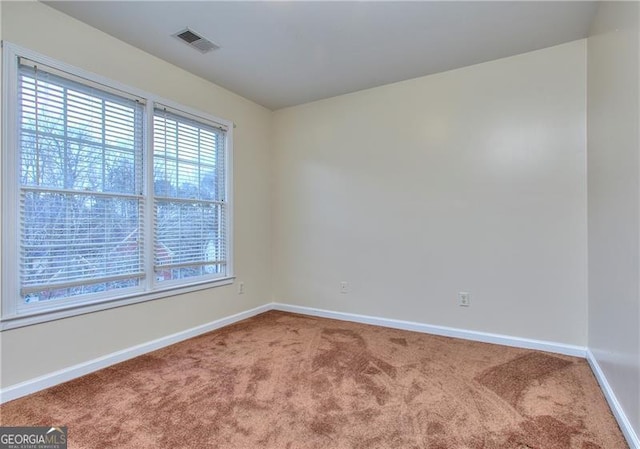 view of carpeted spare room