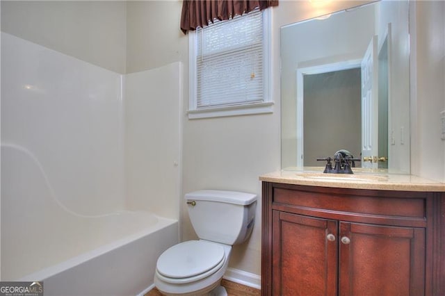 full bathroom featuring bathtub / shower combination, vanity, and toilet