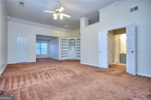 unfurnished bedroom with ornamental molding and carpet flooring