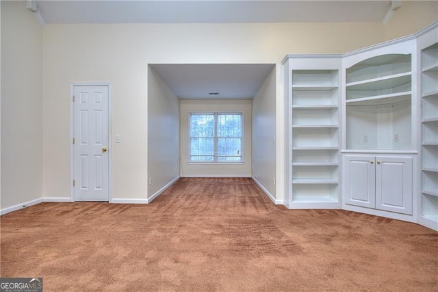 interior space featuring light colored carpet