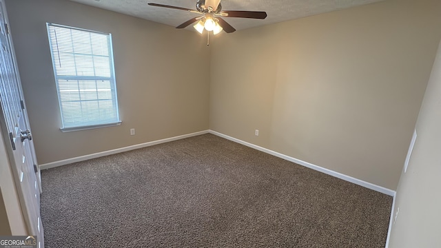 empty room with carpet and ceiling fan