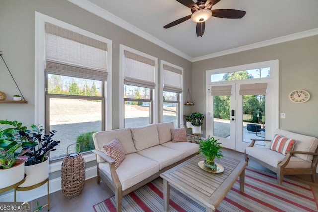 living room featuring ceiling fan, french doors, and crown molding