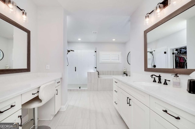 bathroom with an enclosed shower and vanity