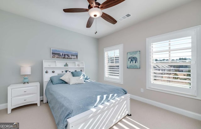 carpeted bedroom with ceiling fan