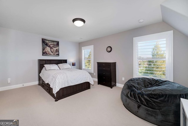 carpeted bedroom featuring vaulted ceiling