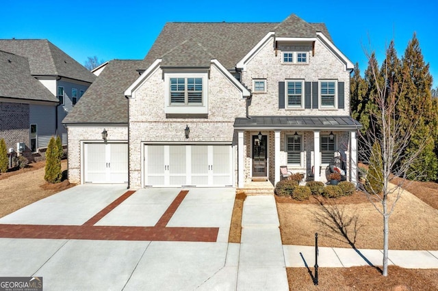 view of front of house with a garage and a porch