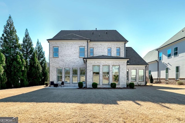 rear view of house with a patio