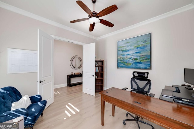 office area featuring ceiling fan, crown molding, and light wood-type flooring