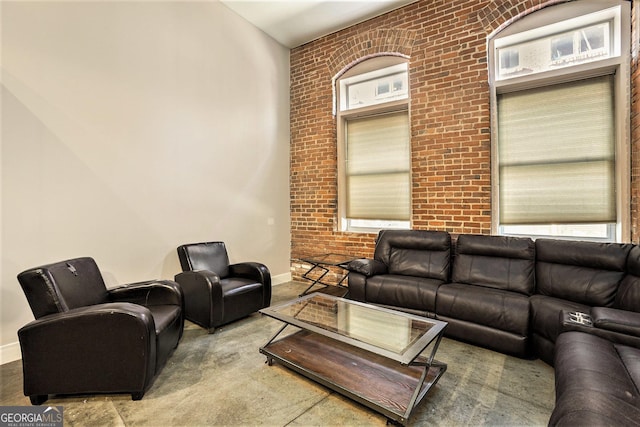 living room with brick wall