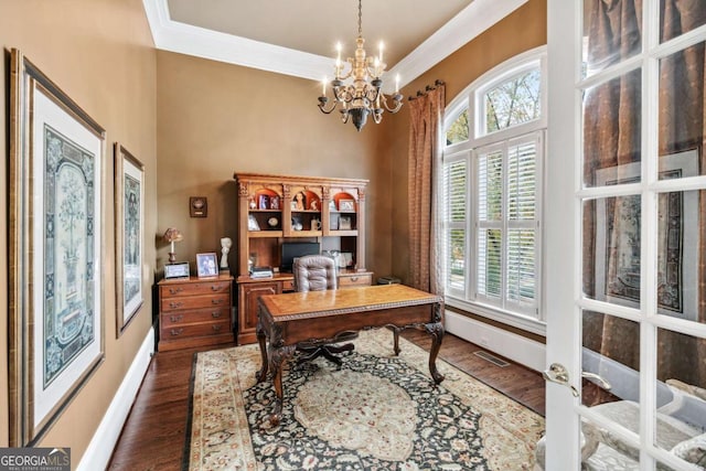 home office featuring french doors, an inviting chandelier, ornamental molding, and dark hardwood / wood-style floors