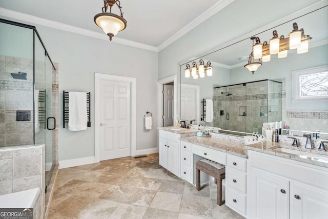 bathroom with a shower with shower door, vanity, and crown molding