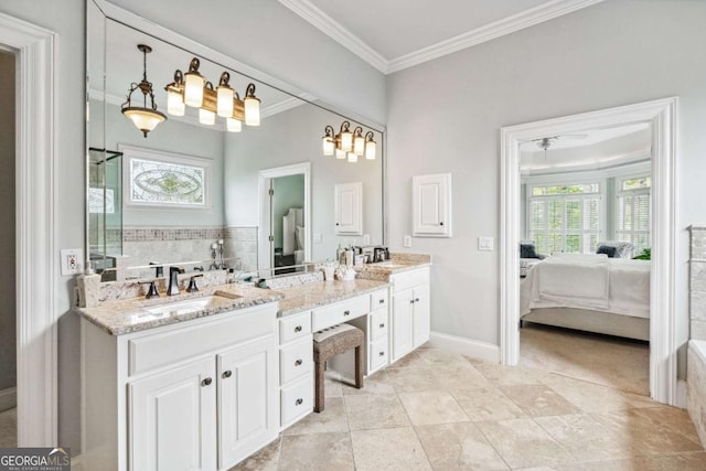 bathroom featuring ceiling fan, a washtub, vanity, and ornamental molding